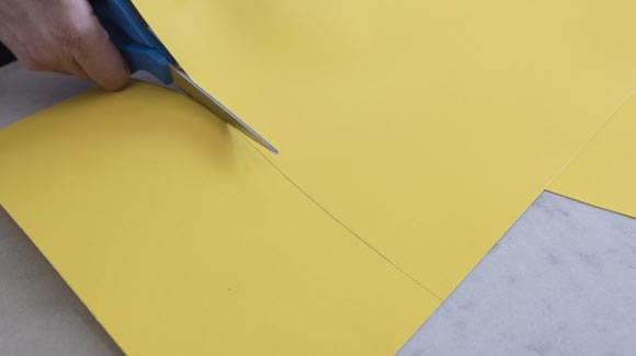 Cutting yellow cardboard