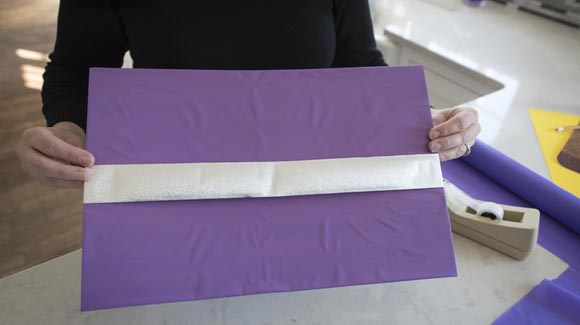 Purple placemat with silver ribbon